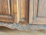 a wooden cabinet that has a door on it