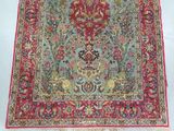 an image of a red and blue rug with a floral design