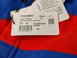 a red and blue striped shirt with a tag on it