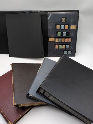 three books are stacked on top of each other on a table