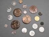 a lot of coins that are on the table