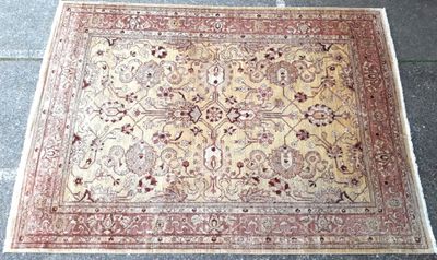 a close up of a rug on the ground on a tile floor