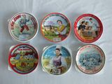 six tins of different flavored ice cream sitting on a table