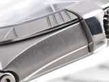 a close up of a watch on a white surface