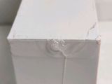 a close up of a white box with a hole in it