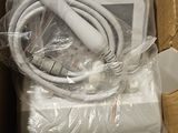 a box that has a charger and a cord in it