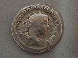 a close up of a silver coin with a man ' s head on it