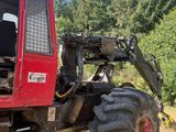 a tractor that is parked on the side of the road