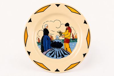 a plate with a picture of a man and a woman on it