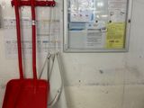 two red shovels and a red shovel in a room