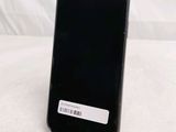 a black phone with a barcode on the back of it