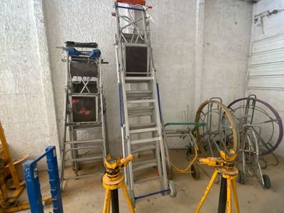 two ladders that are next to each other in a room