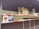 many boxes of food on the shelves in the store