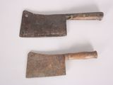 pair of old rusty and rusty tools on a white surface