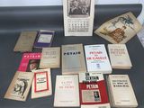 several books on a table with a calendar on top of them