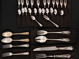 an assortment of silverware including forks, spoons and knives