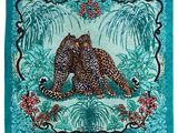 the leopard is sitting on the ground in the jungle