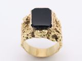 an image of a gold ring with a black stone on it