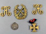 three medals and a medal are sitting on a table