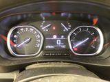 a close up of a car dashboard with various gauges