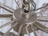 a close up of a chandelier made of glass and metal