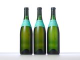three bottles of wine sitting on top of a table next to each other