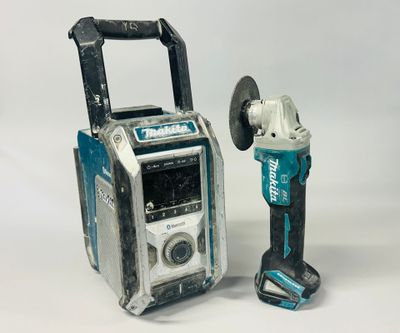 two tools are sitting next to each other on a white surface