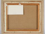 an old picture frame with a piece of paper attached to it