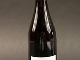 a bottle of wine that is sitting on a table