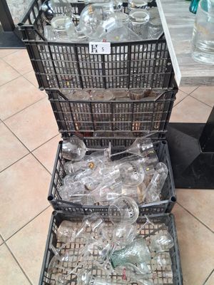 many empty plastic bottles in baskets on the floor