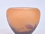 a small glass bowl with a flower design on it