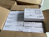 several boxes of electronic devices are stacked on top of each other