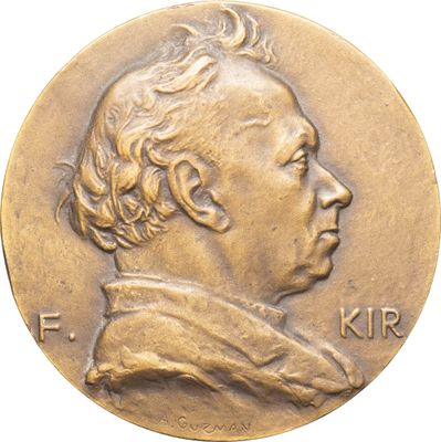 Gros plan sur une pièce de monnaie portant le visage d'un homme