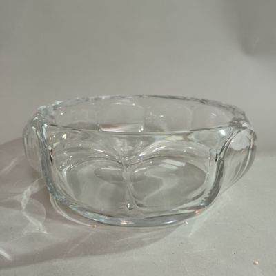 a glass bowl that is sitting on a table