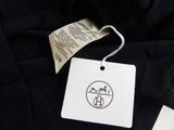 black t - shirt with a tag on it with a picture of a bird on it