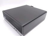 an image of a small black computer on a white surface