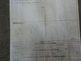 a piece of paper on the floor that has a list of items on it