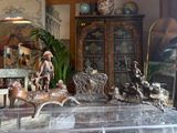 a display case with a lot of antique items on it
