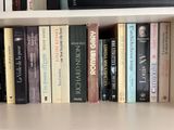 many books that are on a book shelf together