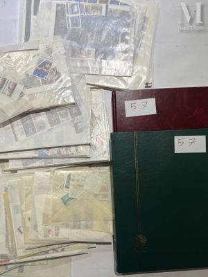 a lot of papers and a binder on a table