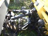 an image of a tractor that has fallen over in the grass