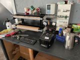 a desk with a computer, printer, printer and other items on it