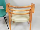 pair of mid century modern chairs in teal and cream fabric