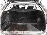 the back of a car with its trunk open and the back seats down