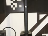 two speakers sitting next to each other on the floor