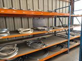 many shelves with different types of metal parts on them