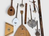 several different types of musical instruments are arranged on a white surface