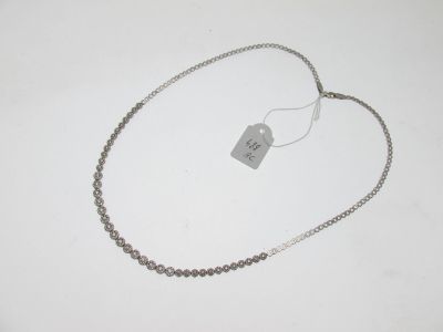 silver plated necklace with a tag on a white background