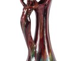 une image représentant un vase coloré sur lequel figure une femme