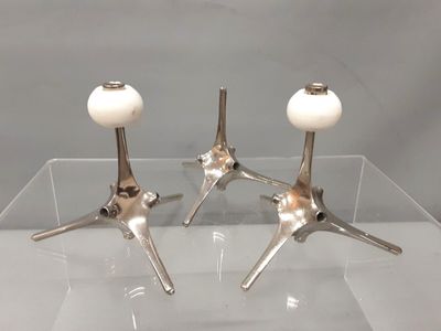 pair of silver plated candlesticks with white glass globes